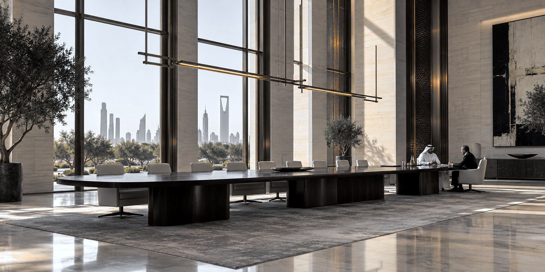 A long boardroom table in a Riyadh tower, two principals in conversation at its far end