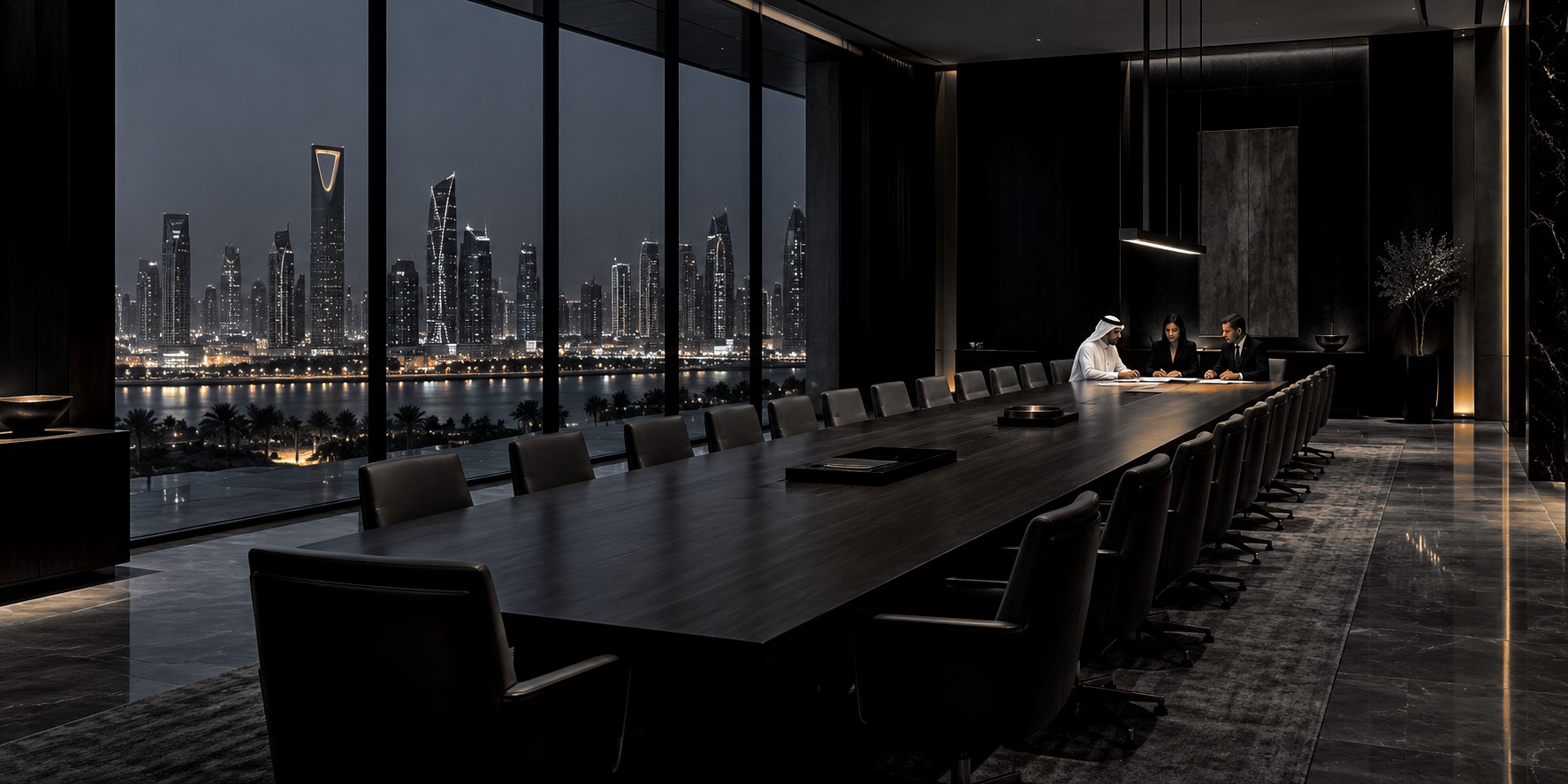 A boardroom at night above the Riyadh skyline, the Kingdom Centre lit beyond the glass